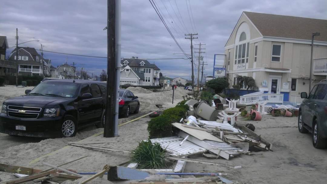 Street littered with debris after storm damage.