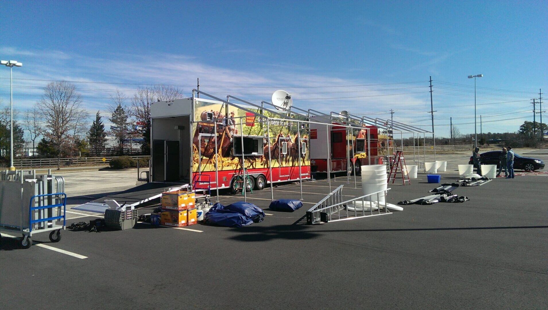 Outdoor food stall setup with colorful banners and cooking equipment.